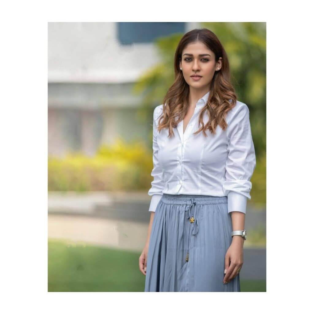 Actress Nayanthara in white shirt and grey skert