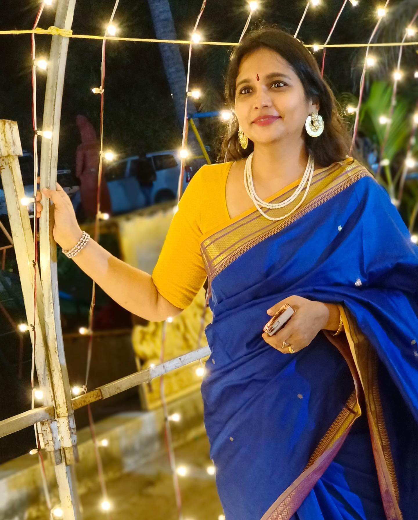 Actress Vinodhini in dark blue saree and yellow blouse