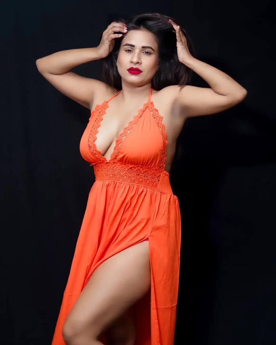 Actress Muskaan Agarwal sexy look in orange gown