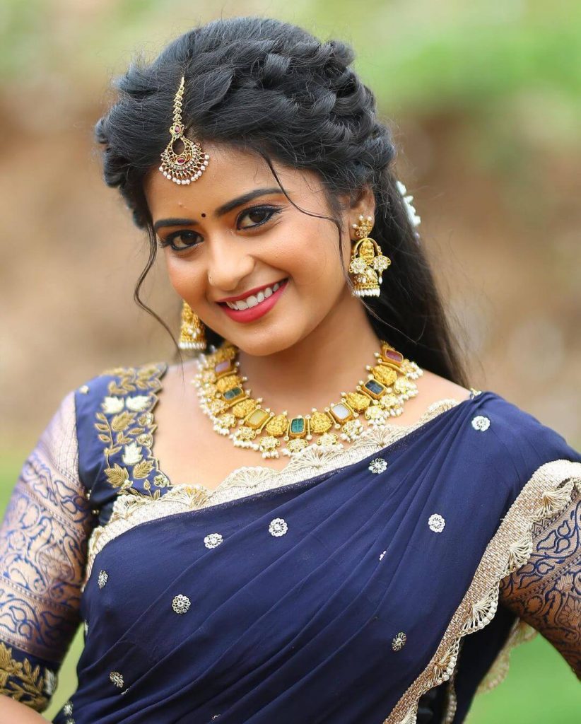 Actress Maahi Gouthami close up in dark blue saree
