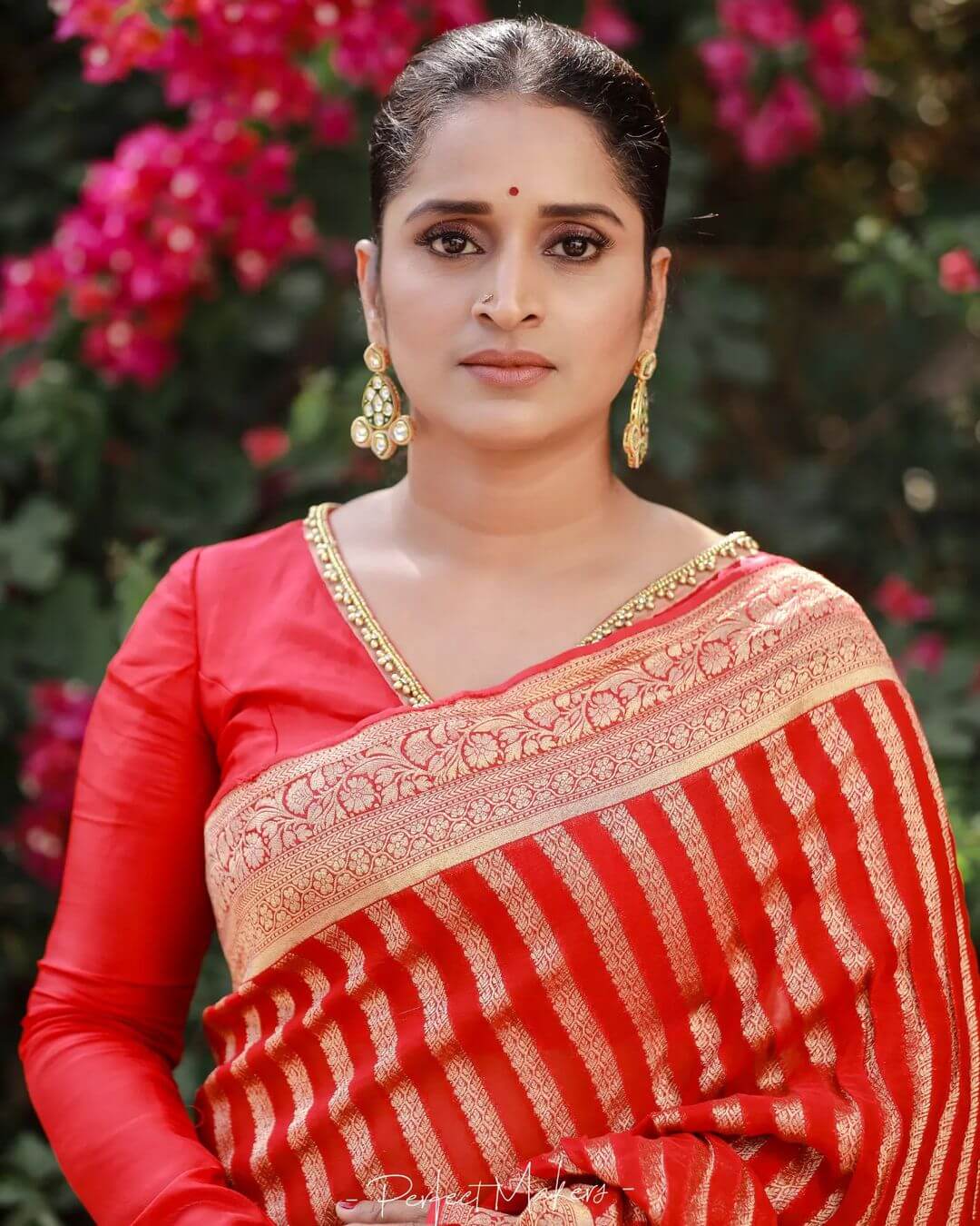 Surabhi Lakshmi close up shot in red saree