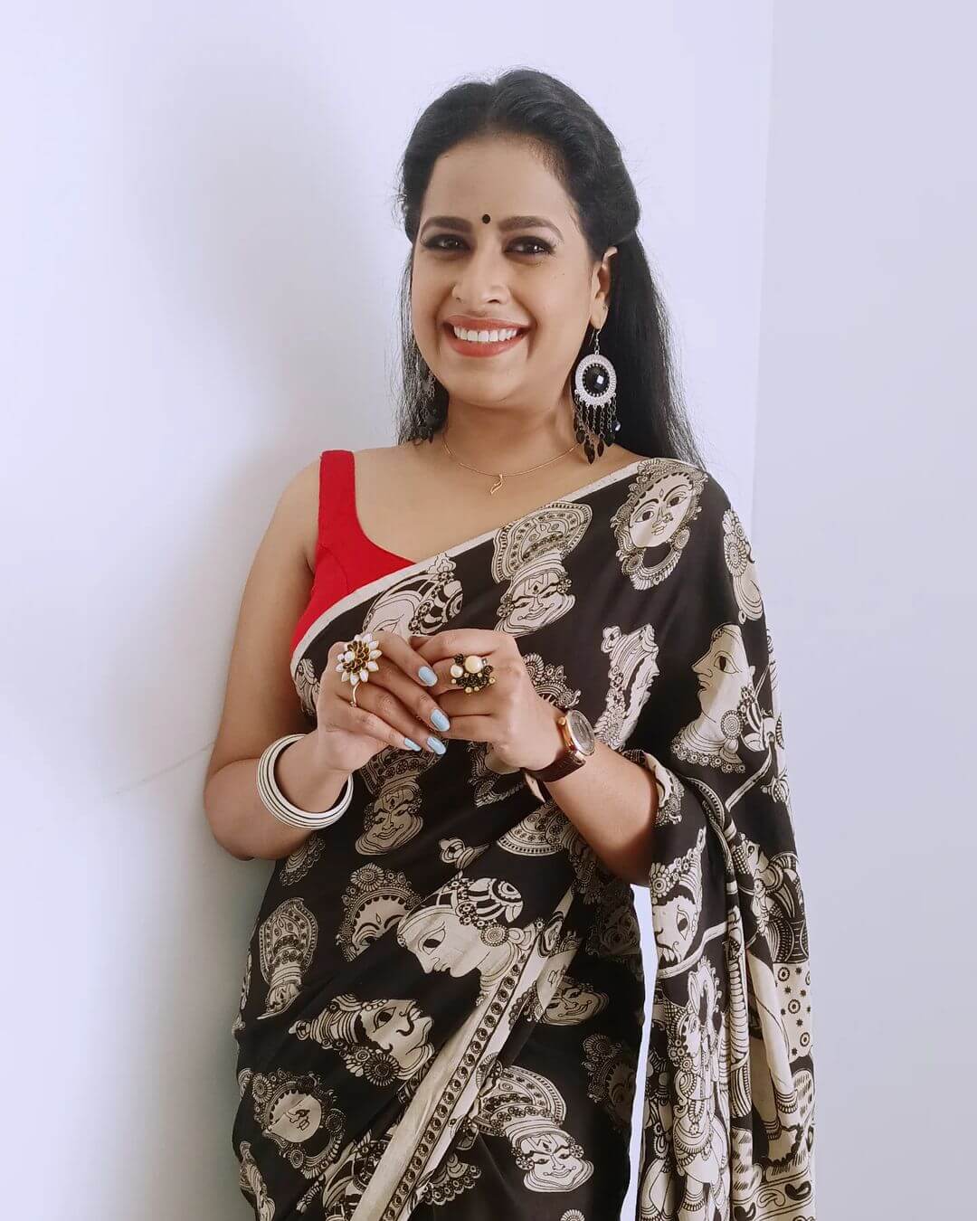 Sadhika Venugopal in saree and sleeveless blows