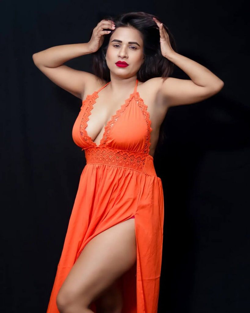 Actress Muskan Agarwal in sexy orange sleeveless night gown
