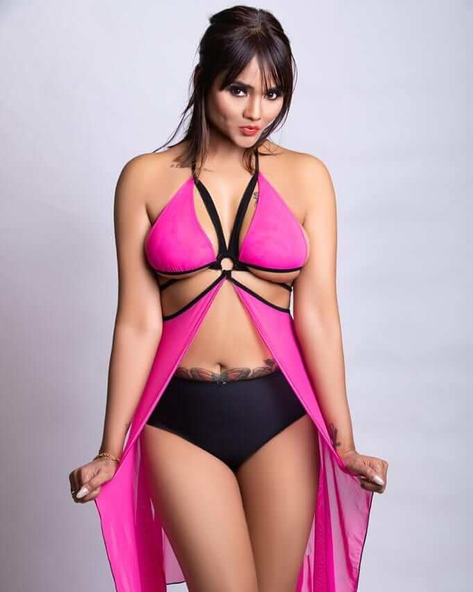 Jinnie Jaaz in pink and back sexy outfit