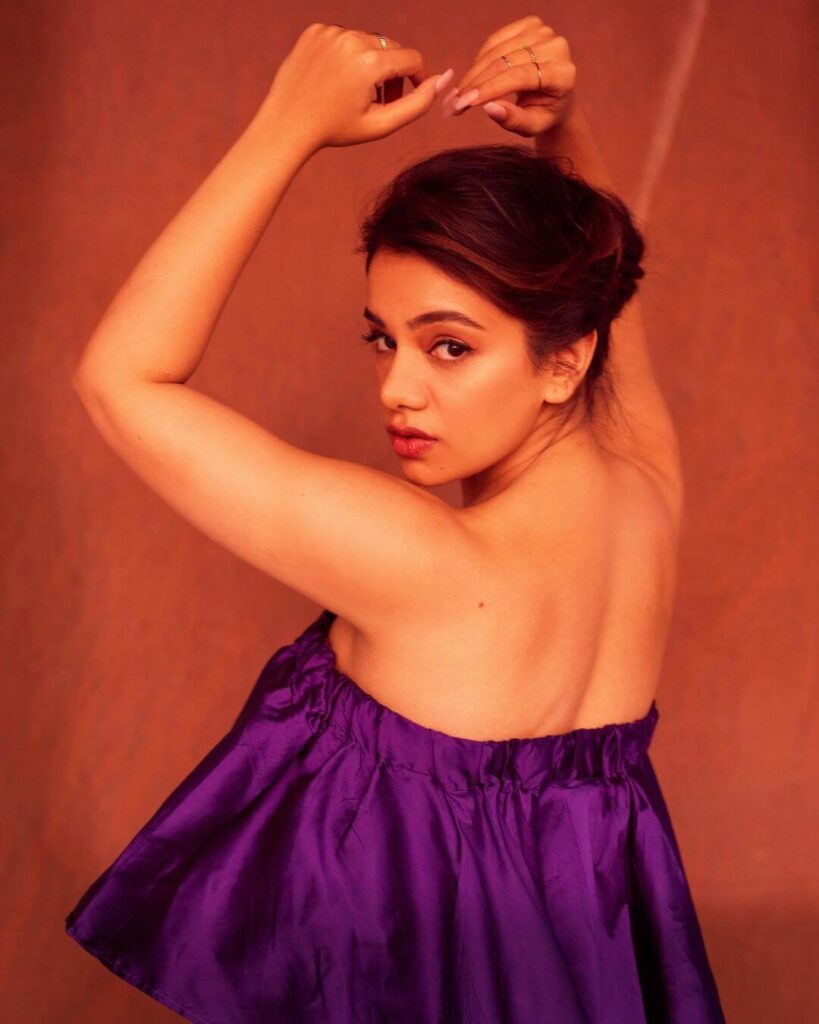Actress Nidhi Singh in sexy violet outfit