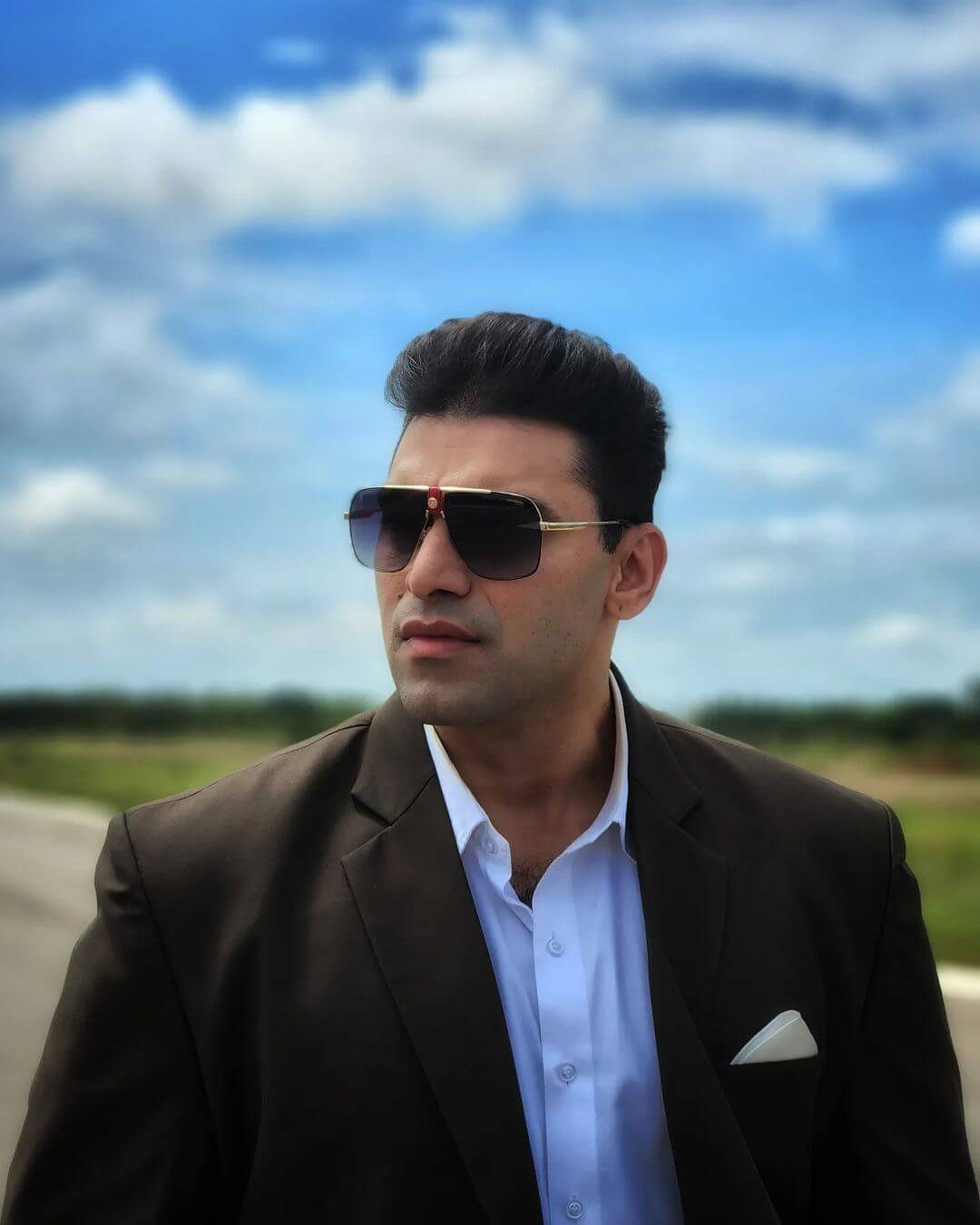 Actor Nikitin Dheer close up in suit