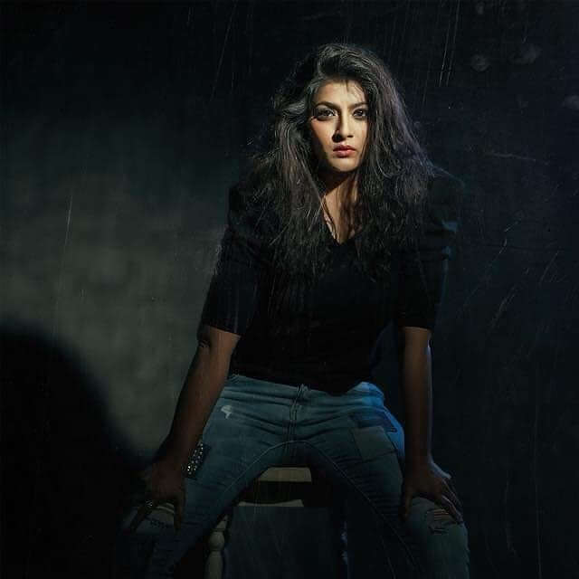 Actress Varalaxmi Sarathkumar in black shirt