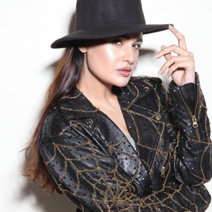 Yuvika Chaudhary in black dress and hat