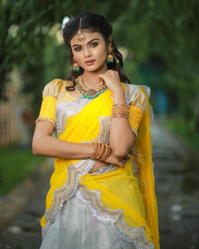 Akshitha Ashok in yellow and silver saree