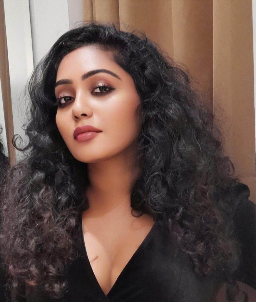 Hima Shankar close up in black outfit