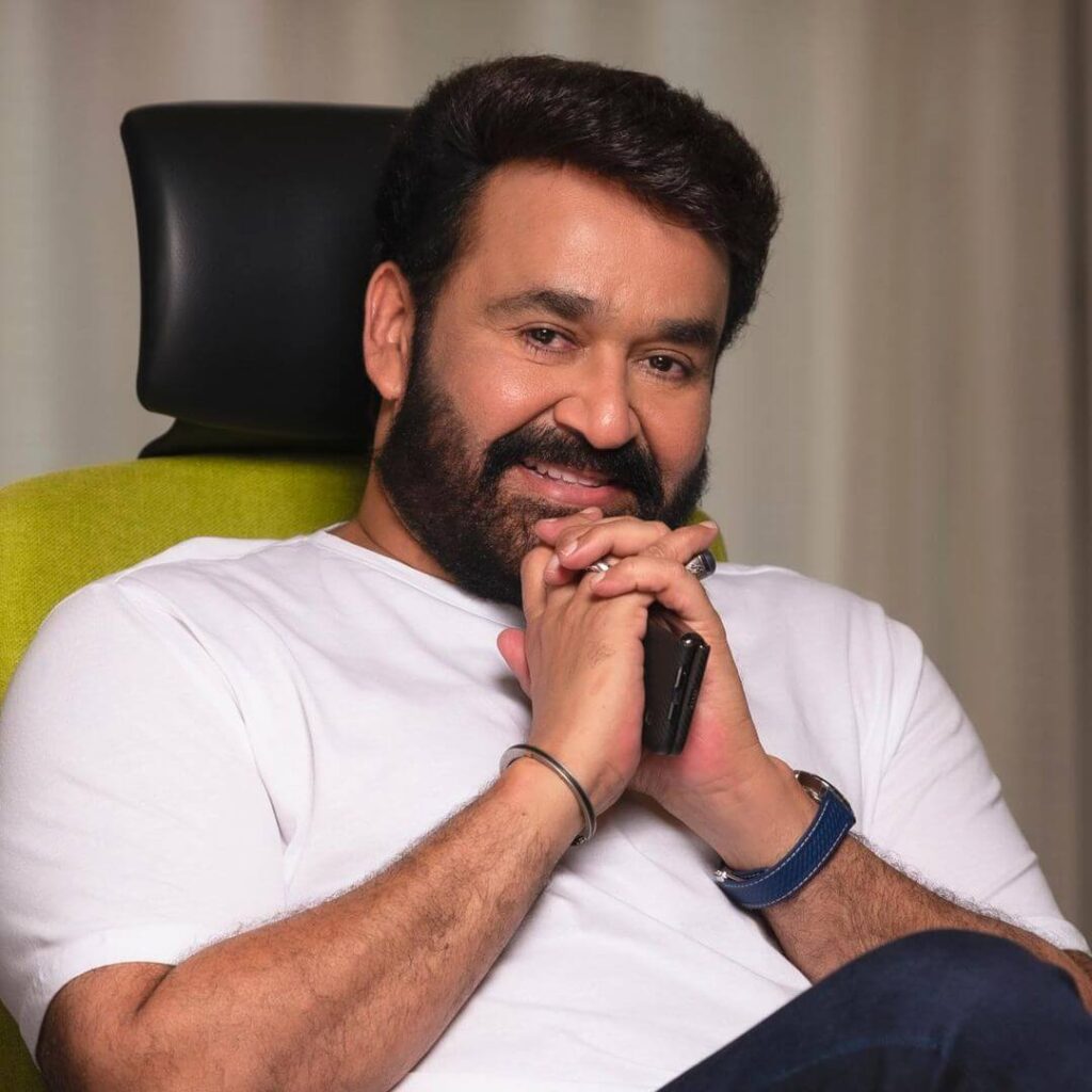 Mohanlal close up shot with a smiling face sitting