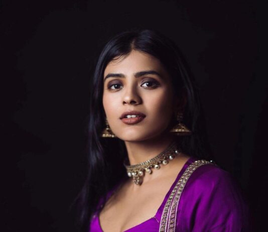 Hebah Patel close up shot in violet sexy outfit
