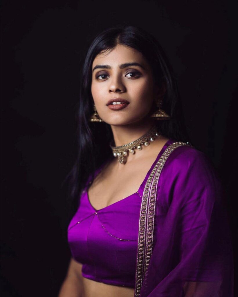 Hebah Patel close up shot in violet sexy outfit