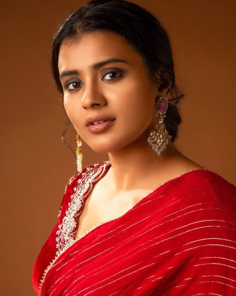 Hebah Patel close up in red dress