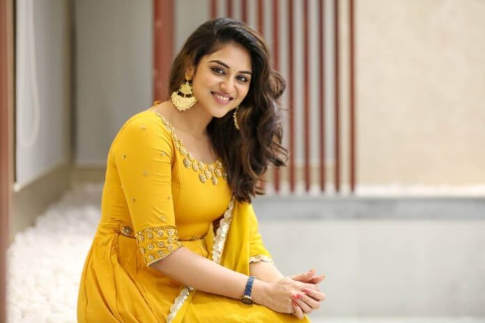 Indhuja Ravichandran in yellow dress