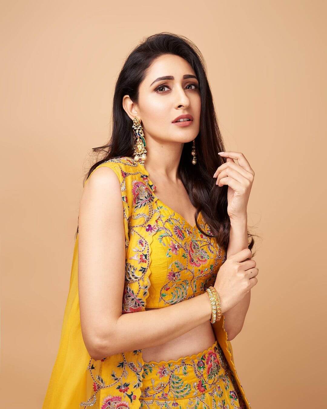 Pragya Jaiswal in stylish yellow dress