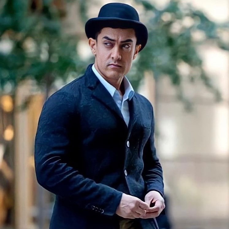 Aamir Khan in black suit and hat
