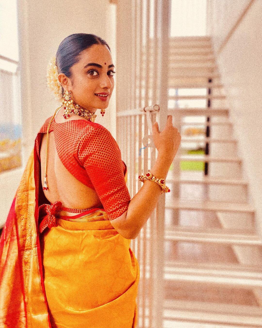 Namitha Pramod in stylish saree from back shot
