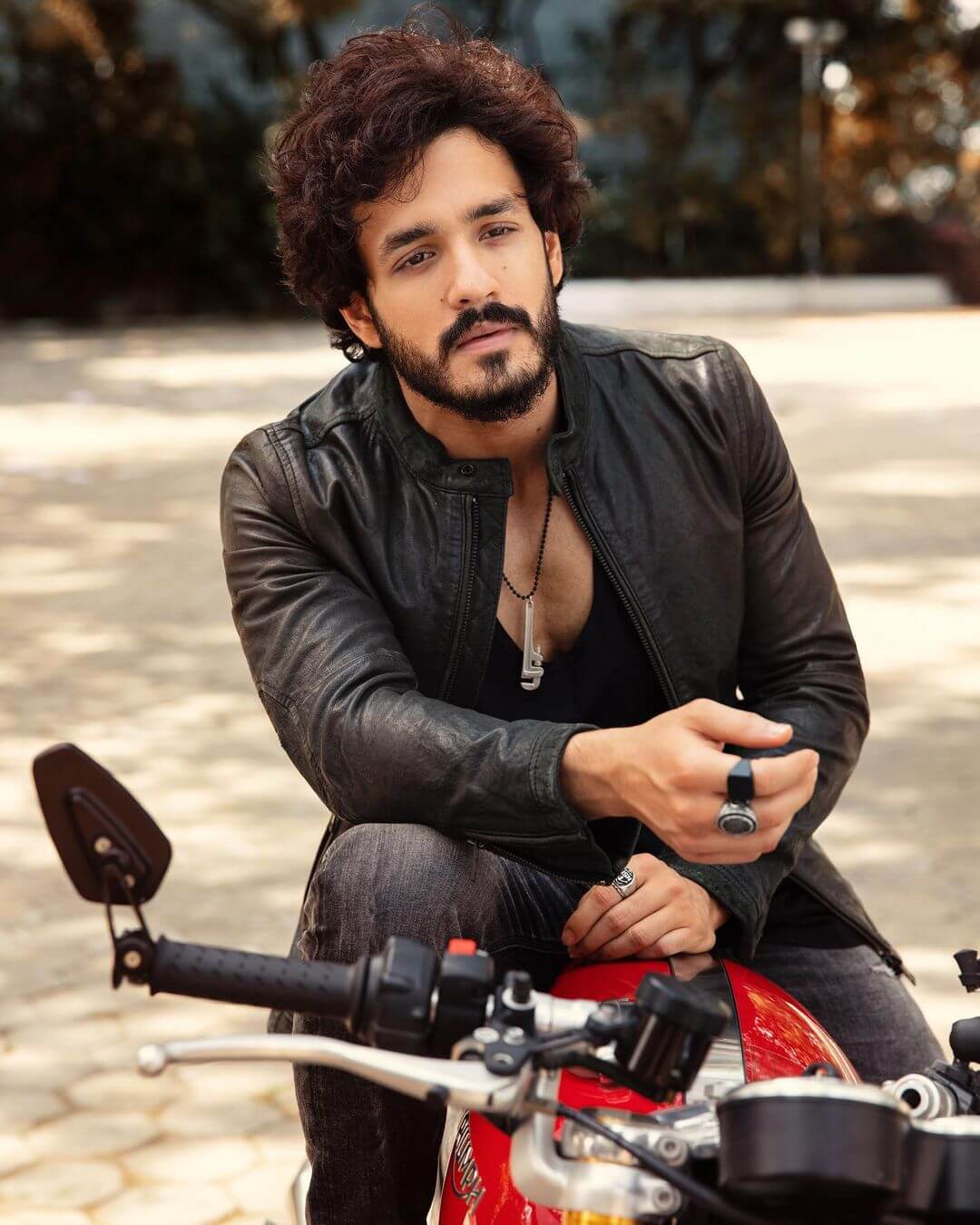 Akhil Akkineni sitting in bike