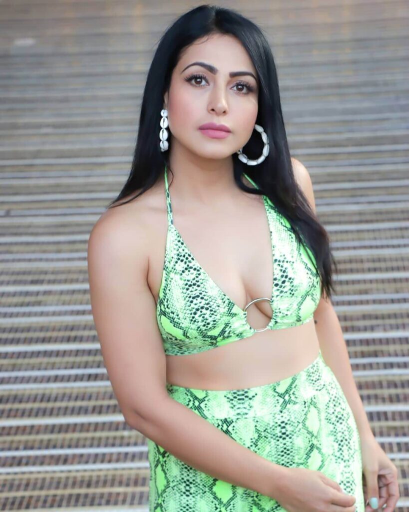 Actress Nandini Rai in sexy green pattern swimsuit