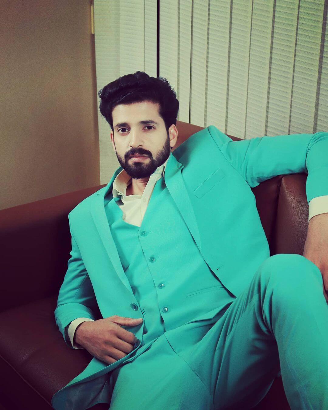 Sanal Krishnan in green suit