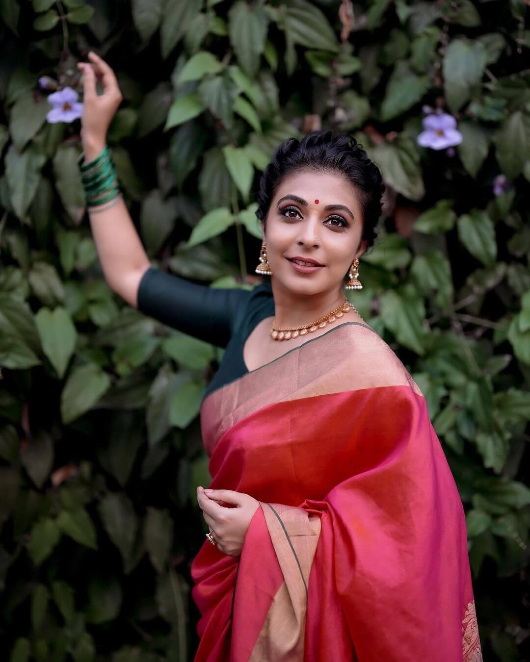 Actress Leona Lishoy in red saree