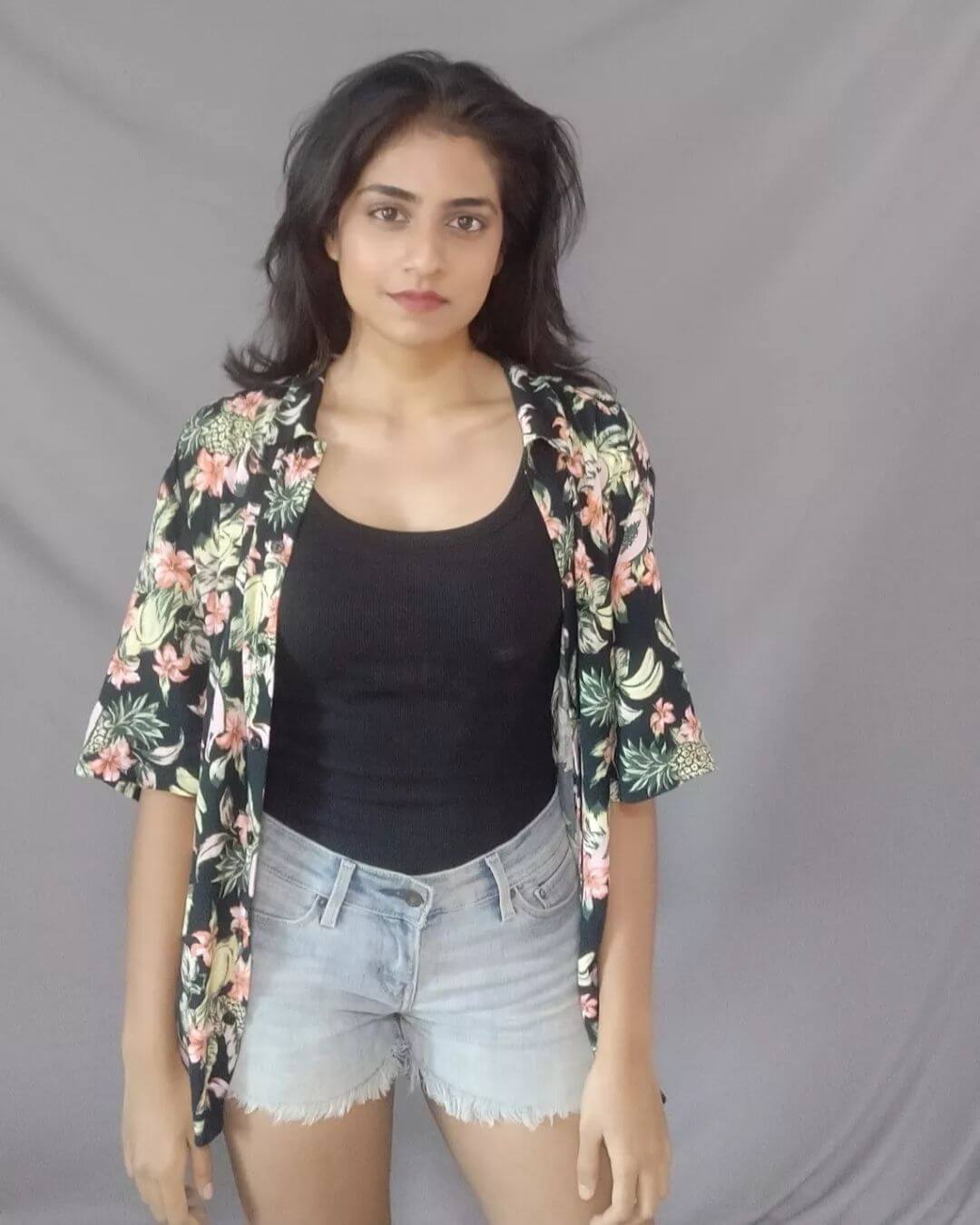 Actress Zarin Shihab in black top and gens shorts