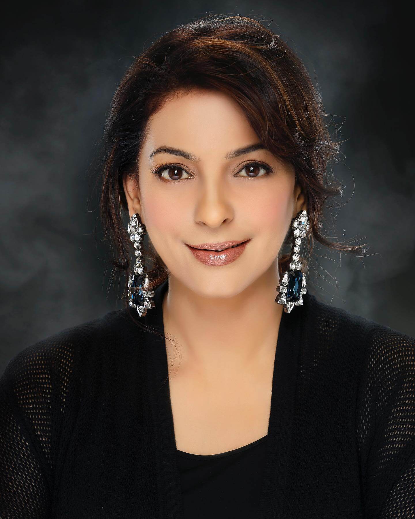Actress Juhi Chawla close up shot in black outfit