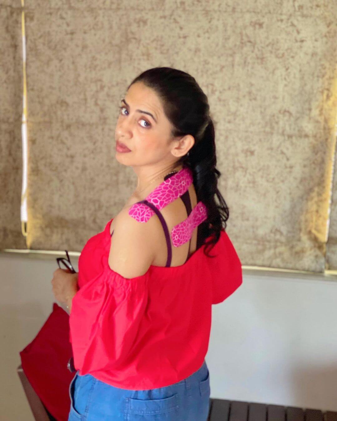 Actress Parinitaa Seth in pink gown shot from back