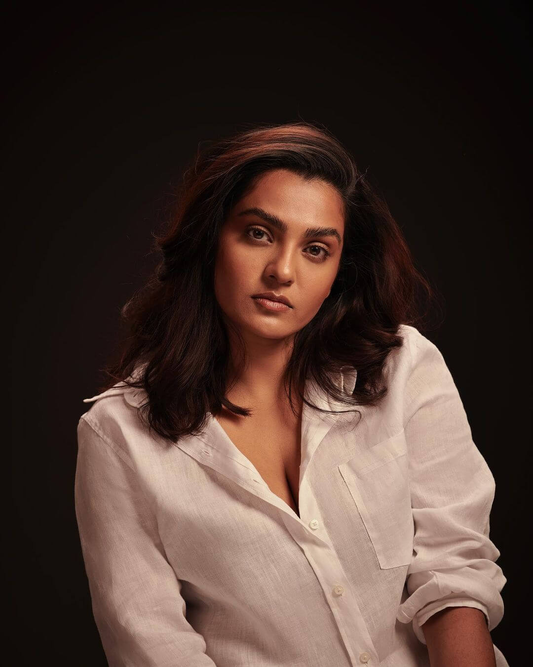 Actress Parvathy Thiruvothu in sexy white shirt