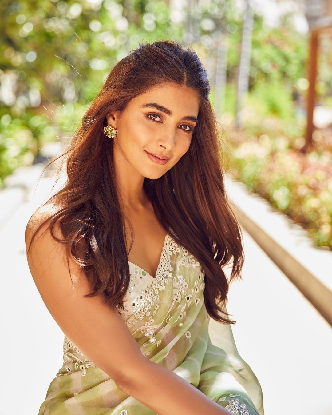 Actress Pooja Hegde close up shot in slevless gown