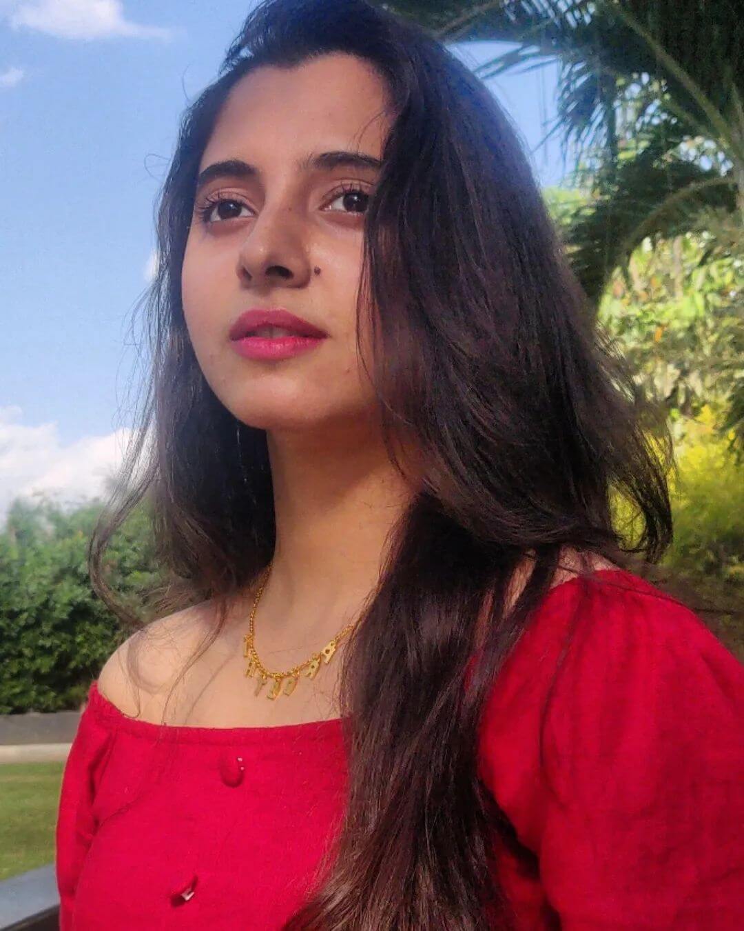 Actress Preethi Anju Asrani closeup shot in red outfit