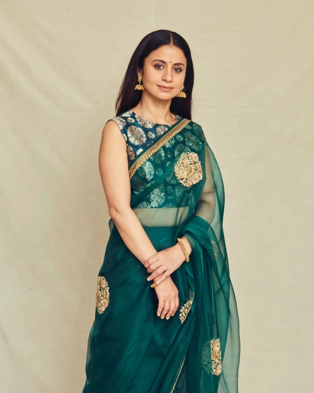 Actress Rasika Dugal in dark green saree