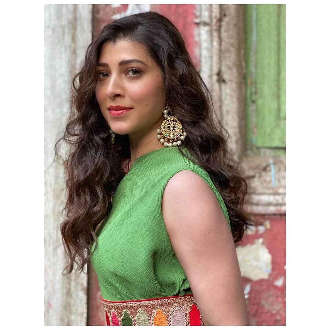 Actress Tejaswini Pandit close up shot in green outfit