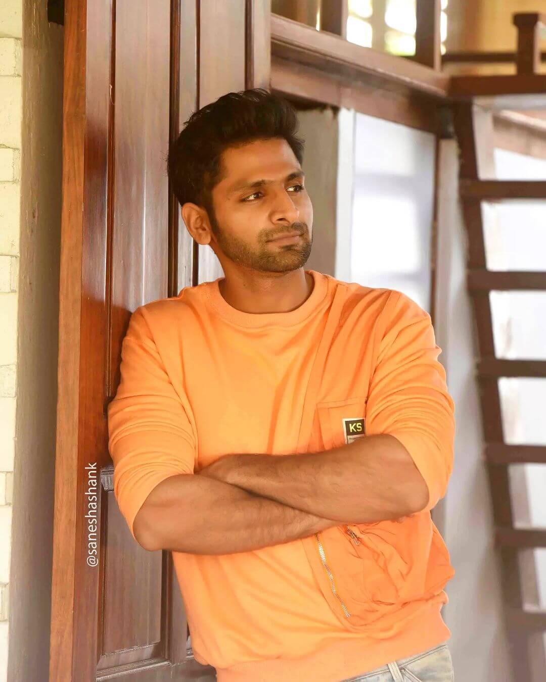 Actor Vaibhav Tatwawadi close up shot in orange tshirt