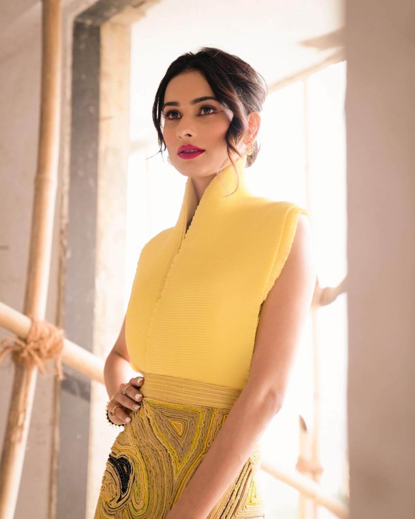 Actress Aneri Vajani in yellow top