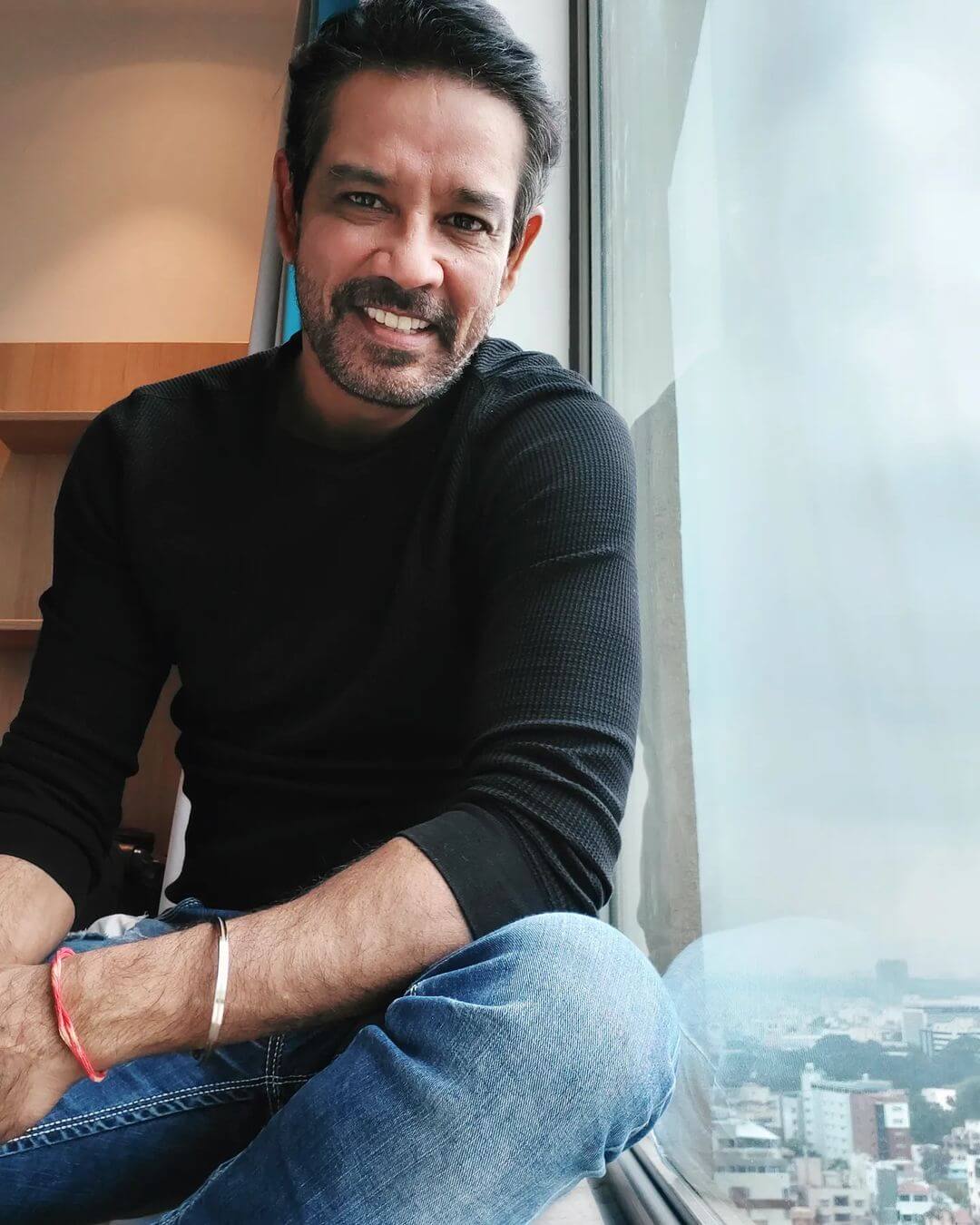 Actor Anup Soni close up shot in black outfit