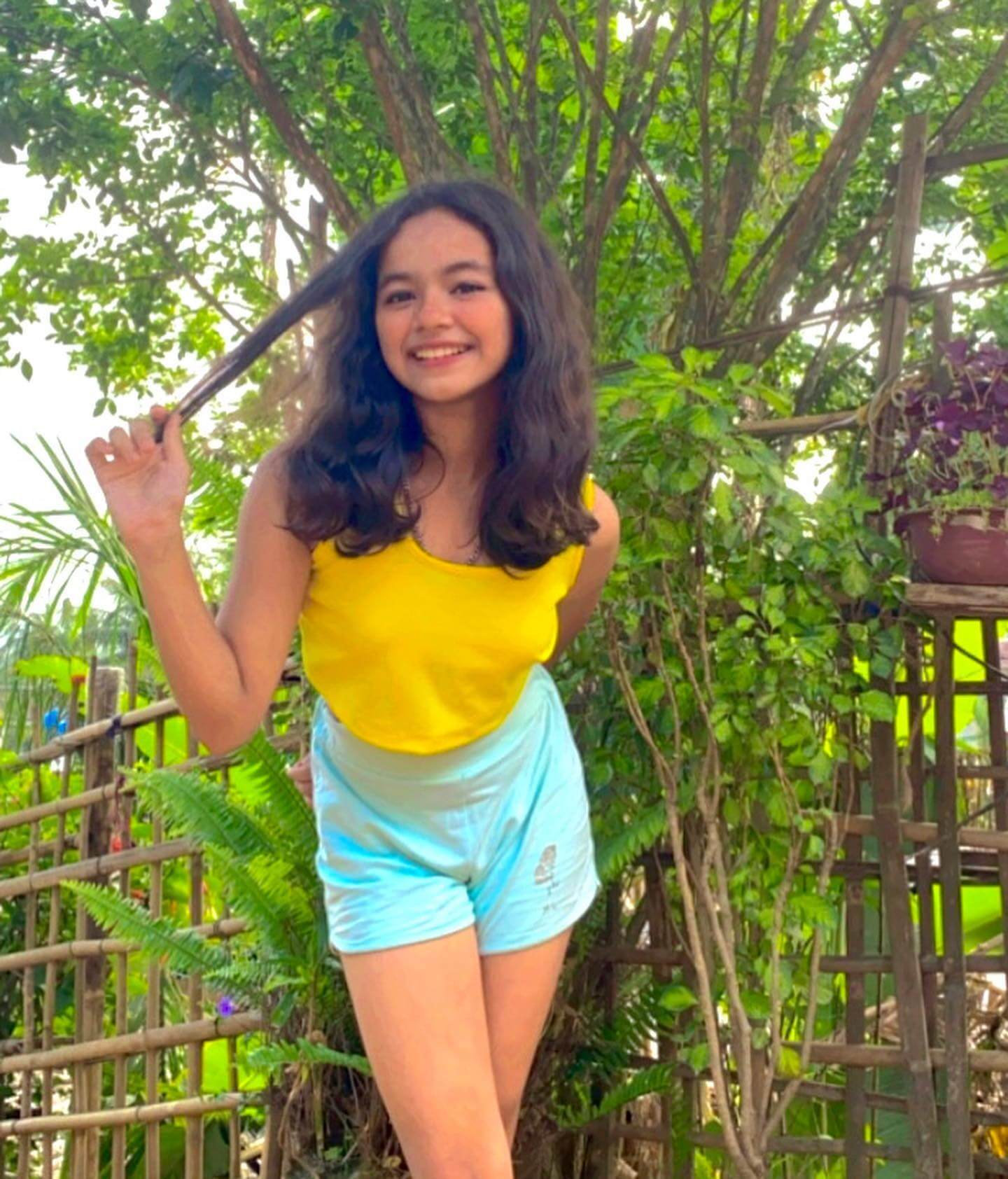 Actress Jayshree Gogoi in sleeveless yellow top and sky blue shorts