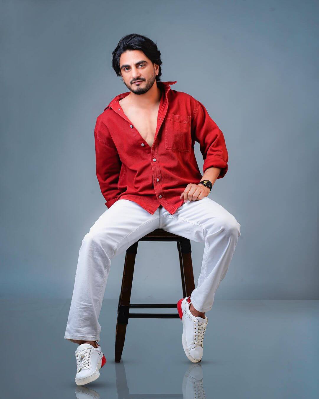 Actor Kulwinder Billa in red shirt and grey pant