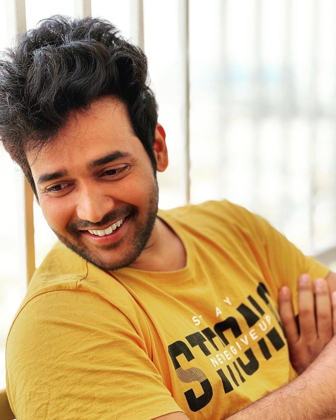 Actor Naresh Agastya close up shot in yellow tshirt