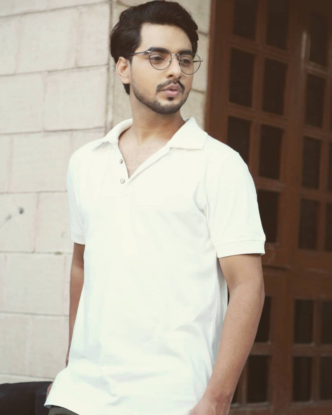 Actor Sagar Kumar close up shot in white shirt