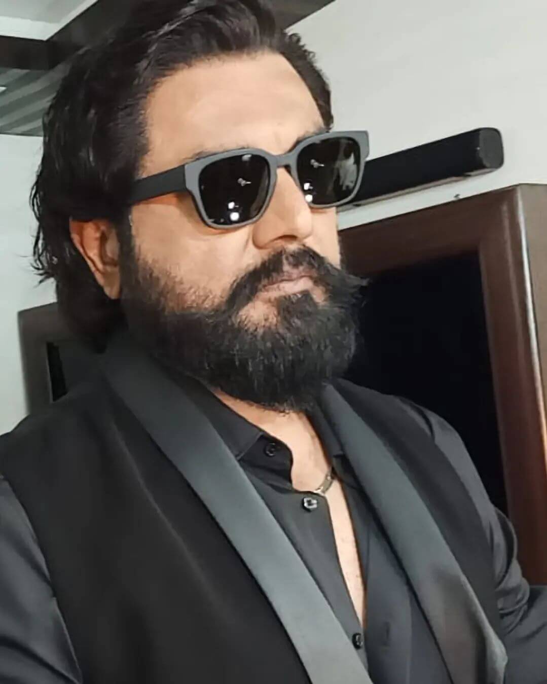 Actor Sarath Kumar close up shot in black suit
