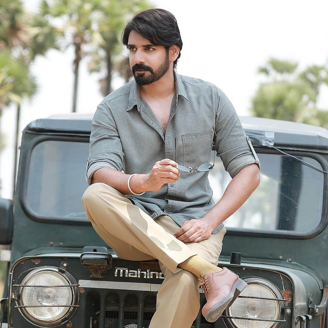 Actor Sushanth sitting in top on jeep