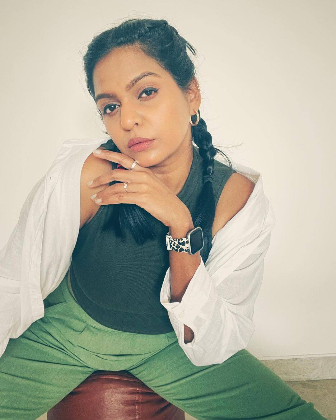 Actress Swetha Vinod in dark green sleeveless top