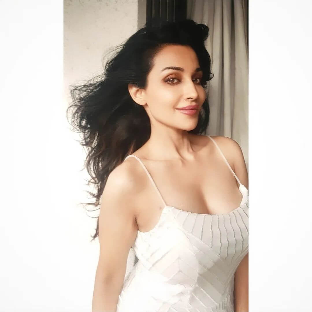 Actress Flora Saini in sexy white bodycon top