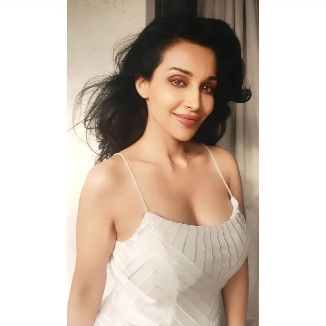 Actress Flora Saini in sexy white bodycon top