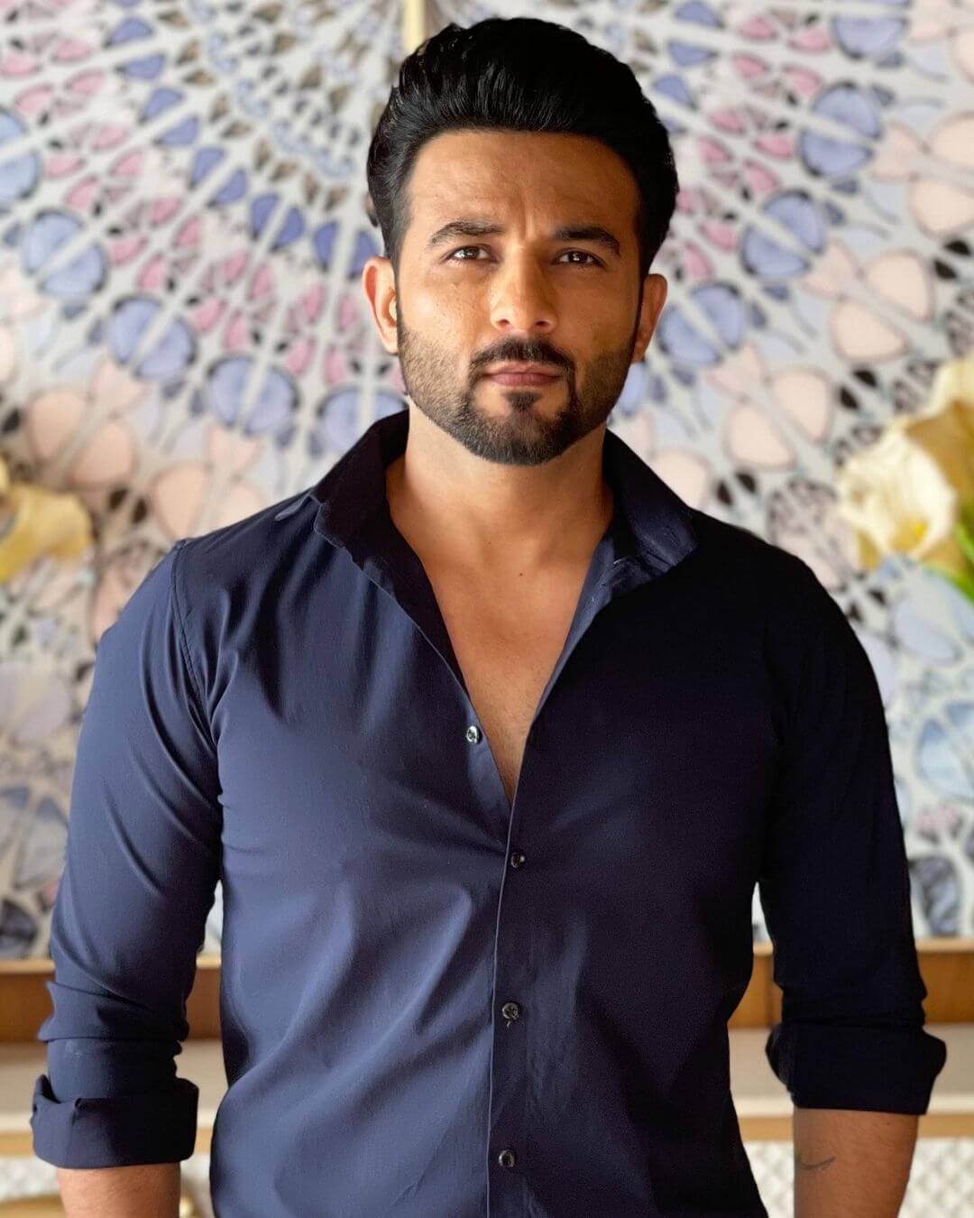 Actor Harish Verma close up shot in dark blue shirt