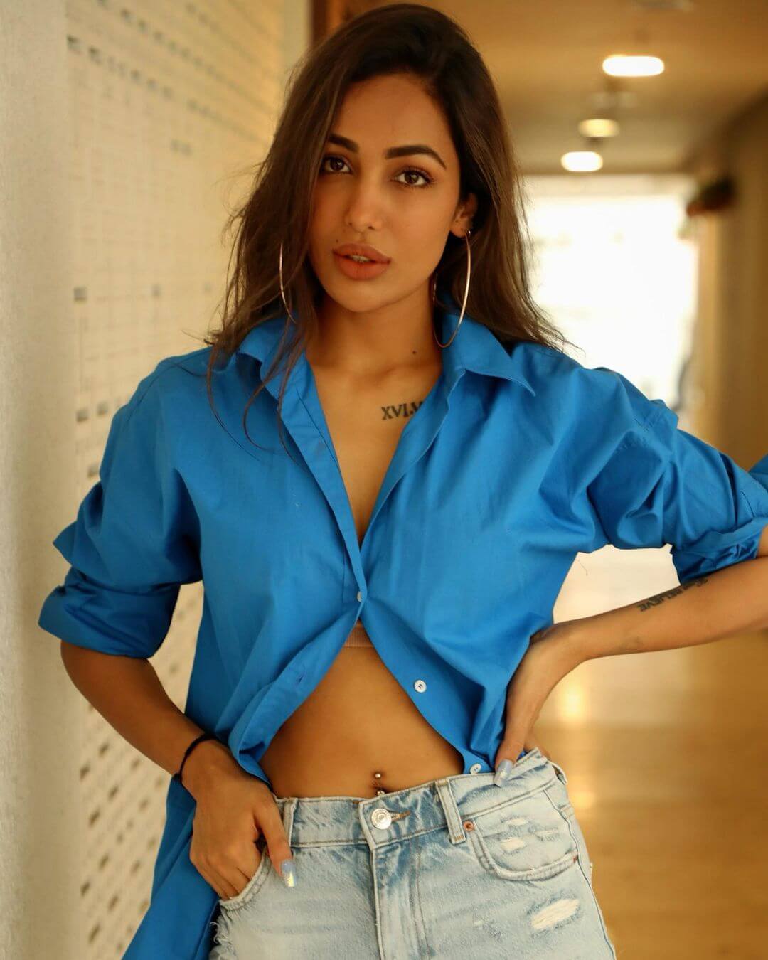 Actress Heera Sohal sexy look in blue shirt