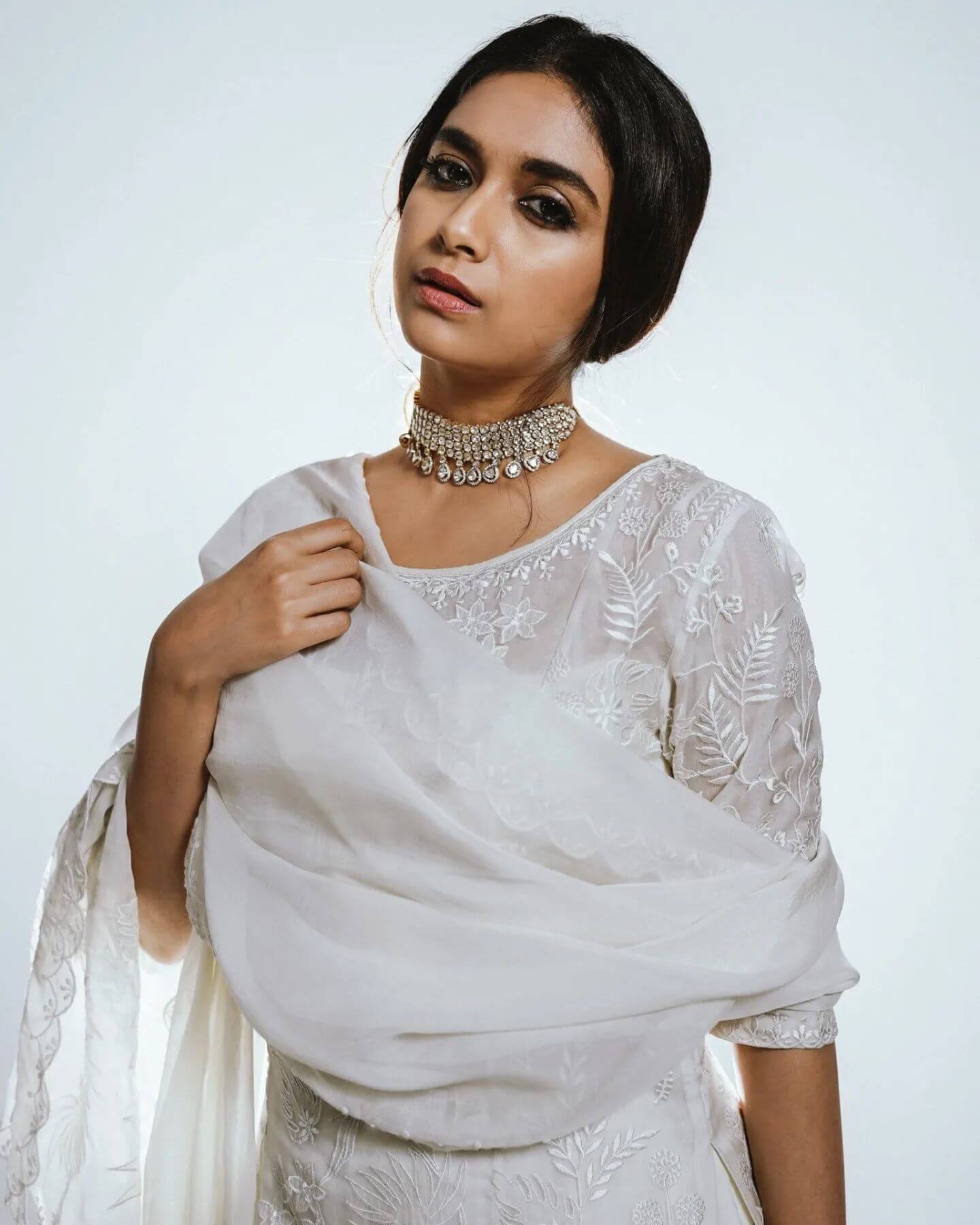 Actress Keerthy Suresh in white salwar and dupatta