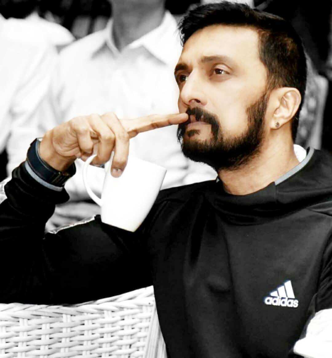 Actor Kichcha Sudeep close up shot in black outfit